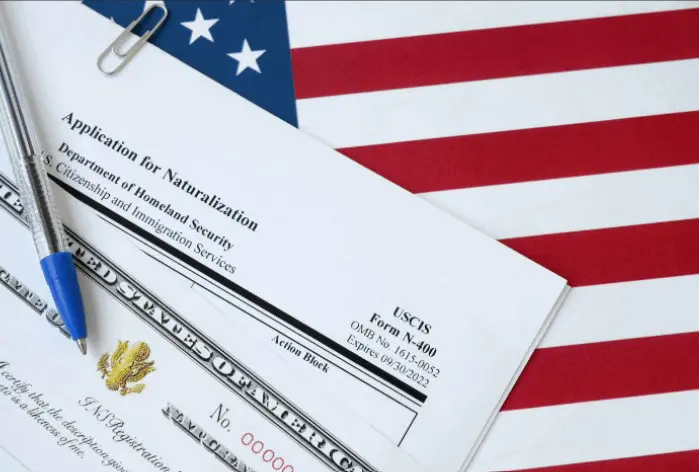 A close up of an american flag and some papers