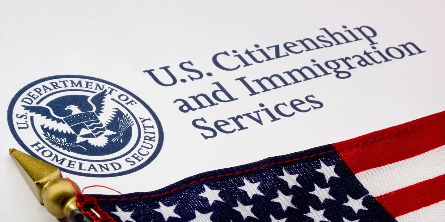 A close up of the u. S. Citizenship and immigration services logo